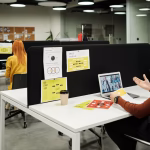 Colleague collaborating virtually on a video call at a modern workspace