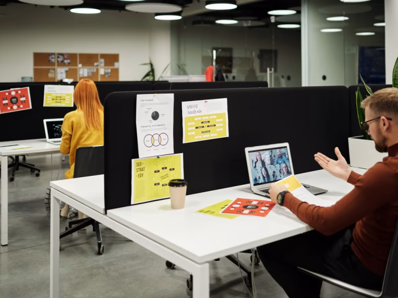 Colleague collaborating virtually on a video call at a modern workspace